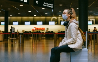 Girl sitting on suitcase